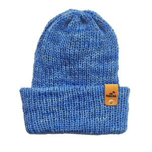 Blue knit beanie with a leather patch on a white background